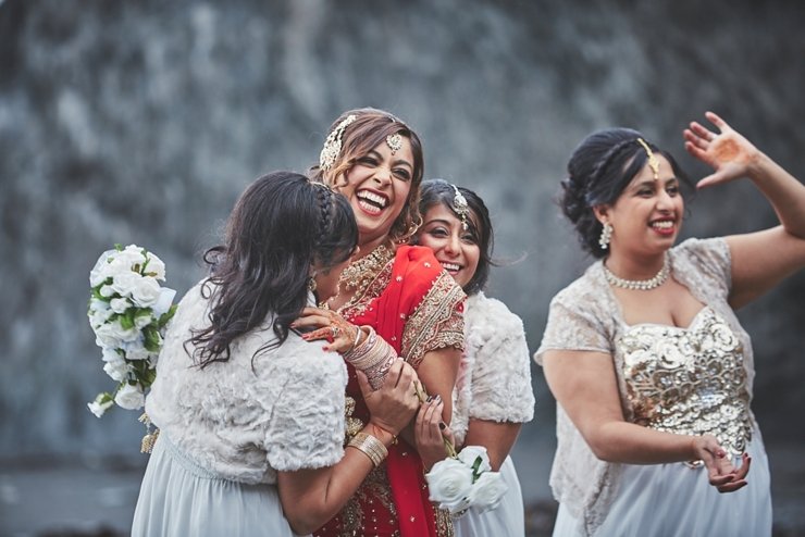 modern sikh and hindu wedding with bride and bridesmaids having fun at tunnels beaches