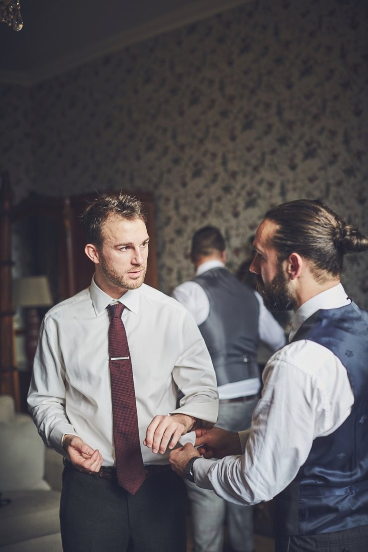 groom and ushers and best man getting ready at Huntsham Court wedding in Devon