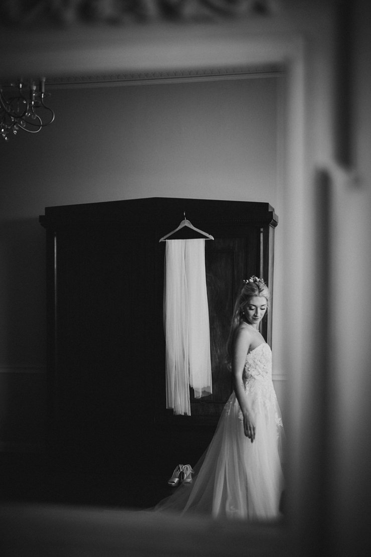 reflection in mirror of bride at Rockbeare Manor