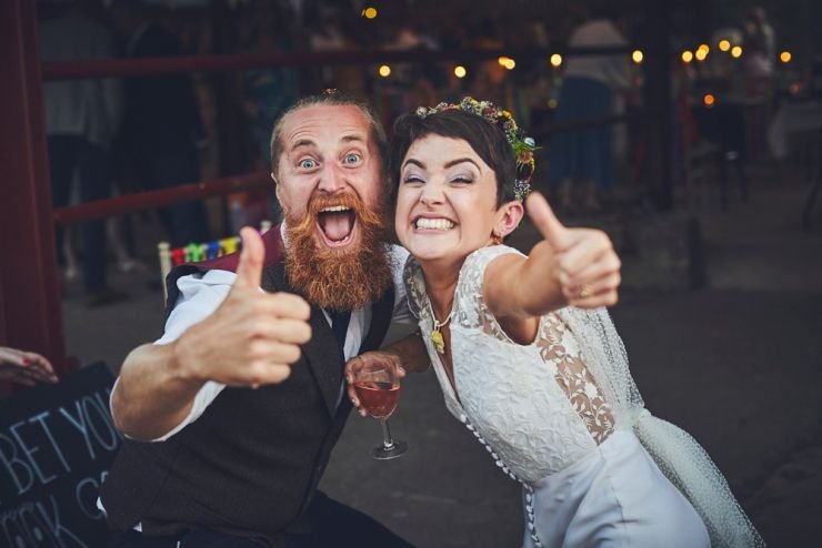 bride and guest doing thumbs up happy at West Town Farm in devon