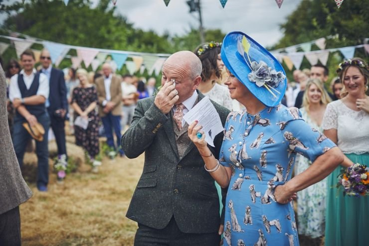 mum and dad emotional at hand tying humanist wedding ceremony at West Town Farm in Exeter