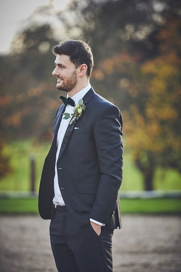 groom wearing black tie at his Rockbeare Manor wedding in Devon