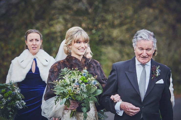 bride and groom and bridesmaids walk to the ceremony at Huntsham Court Devon