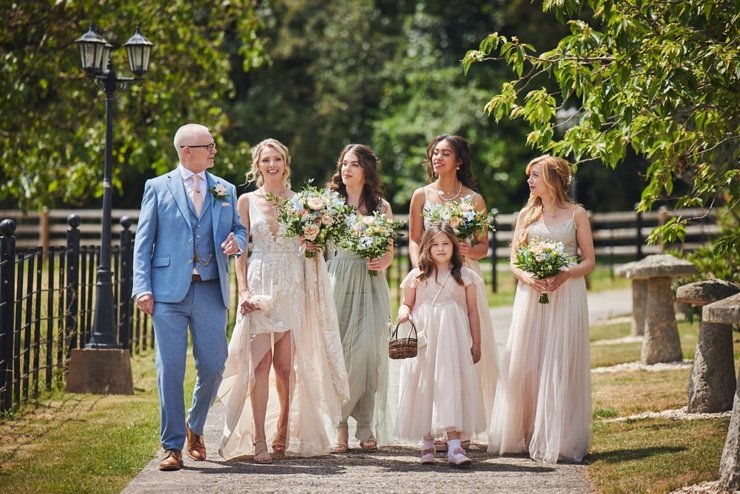 bridal party walk to ceremony at Upton Barn Devon