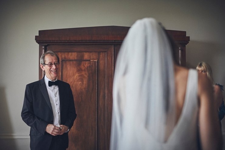 Dad smiling at his daughter before the ceremony at a micro wedding at rockbeare manor devon