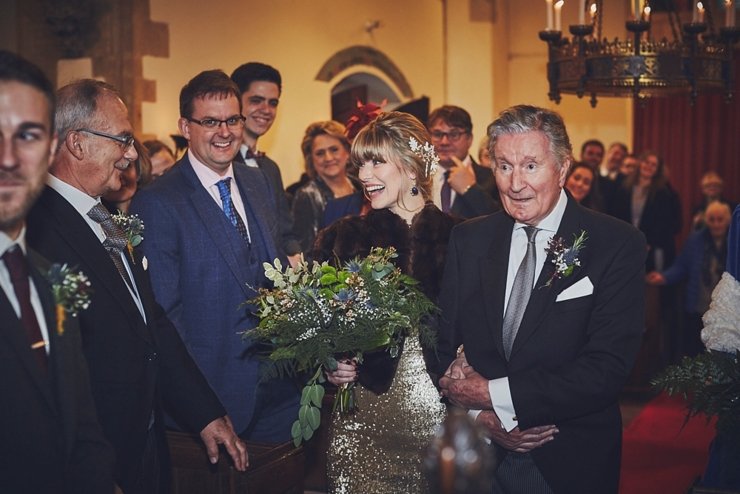 father of the bride walking down the aisle with bride at wedding at Huntsham Court Devon