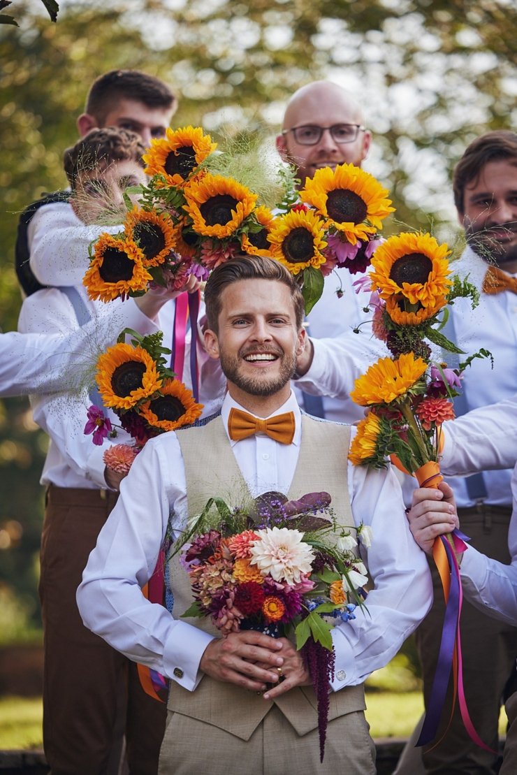 groomsmen with bouquets at Hayne in devon
