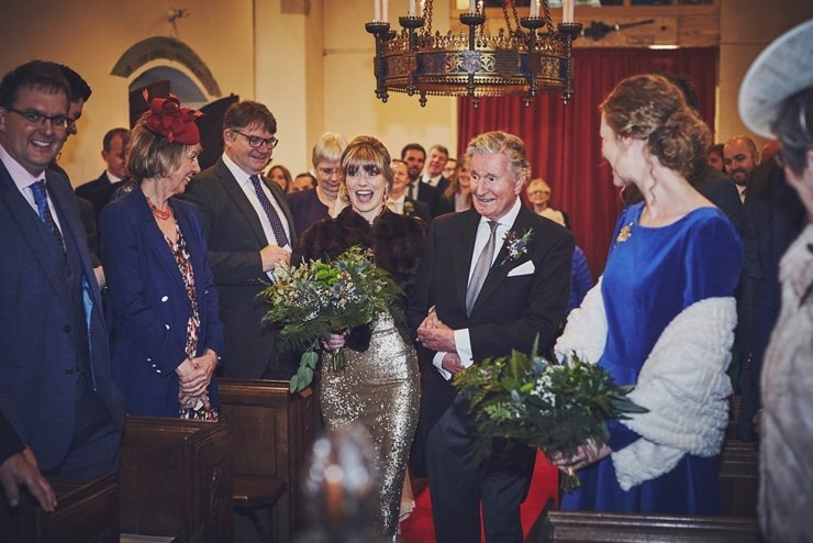 father of the bride walking down the aisle with bride at wedding at Huntsham Court Devon