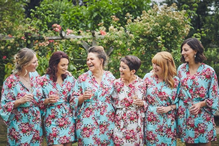 bridesmaids laughing in garden before wedding 