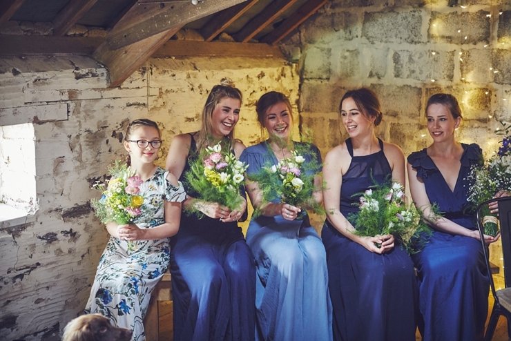 bridesmaids giggling humanist ceremony at East Soar in Devon