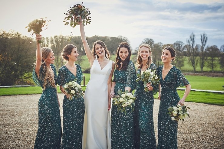 bride and bridesmaids at golden hour at small winter wedding at Rockbeare manor in Devon