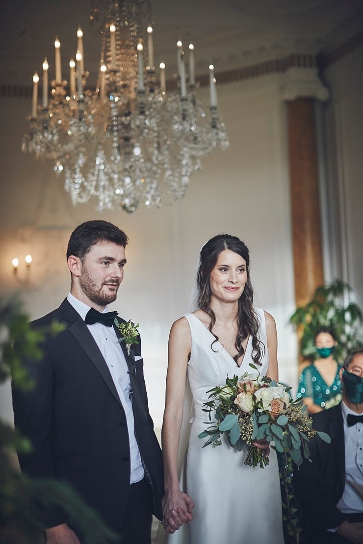 wedding photography of bride and groom smiling at small wedding at Rockbeare manor in Devon