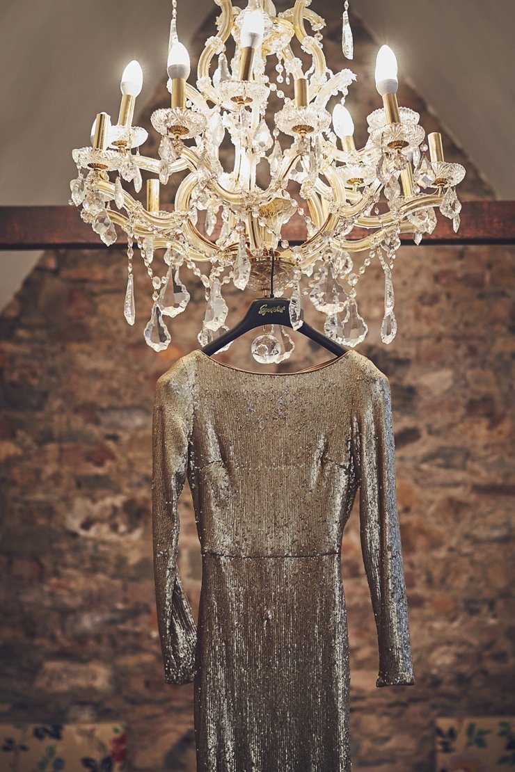 gold sequinned wedding gown hanging at Huntsham Court in Devon