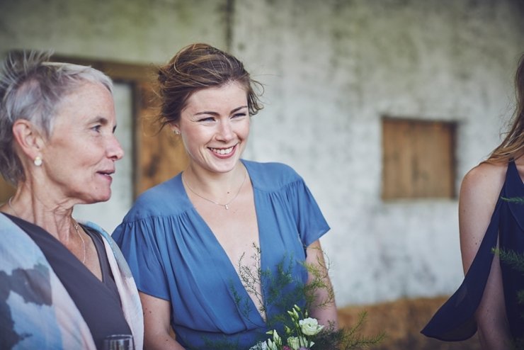 natural wedding photo of happy guest at eco wedding at East Soar Farm in Devon